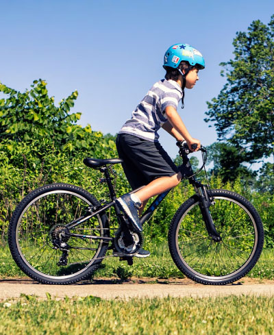 child riding a rental bike on nantucket